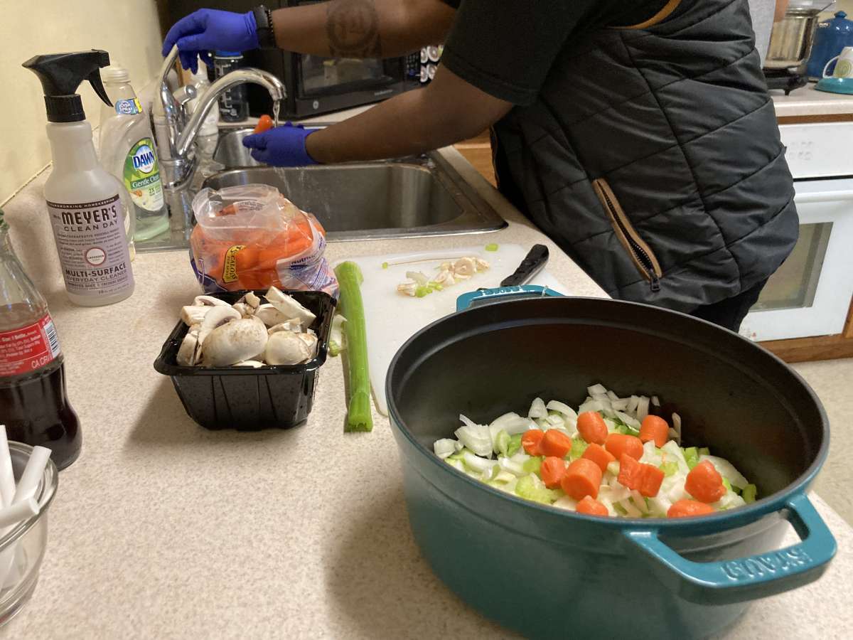 Student cooking in Sloss House kitchen